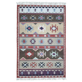 Handwoven rust beige geometric wool-blend rug with teal and purple accents, fringe edges and tribal pattern. Available in multiple sizes for all living spaces