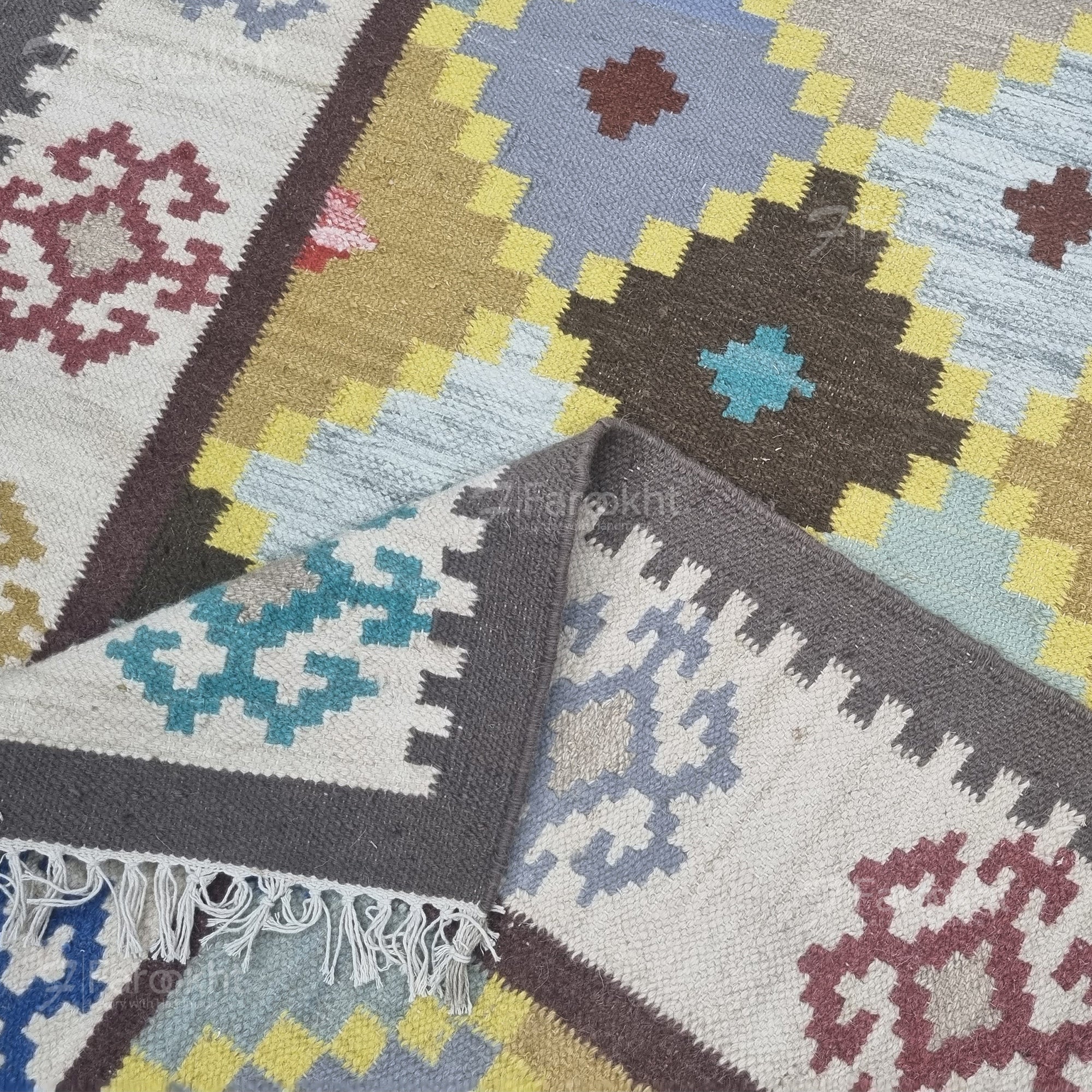 Collection of patterned rugs with geometric designs in various colors.