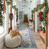 Long decorative rug on a wooden floor in a home interior with sliding doors and windows.