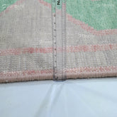 Rug with a ruler for scale on a white background